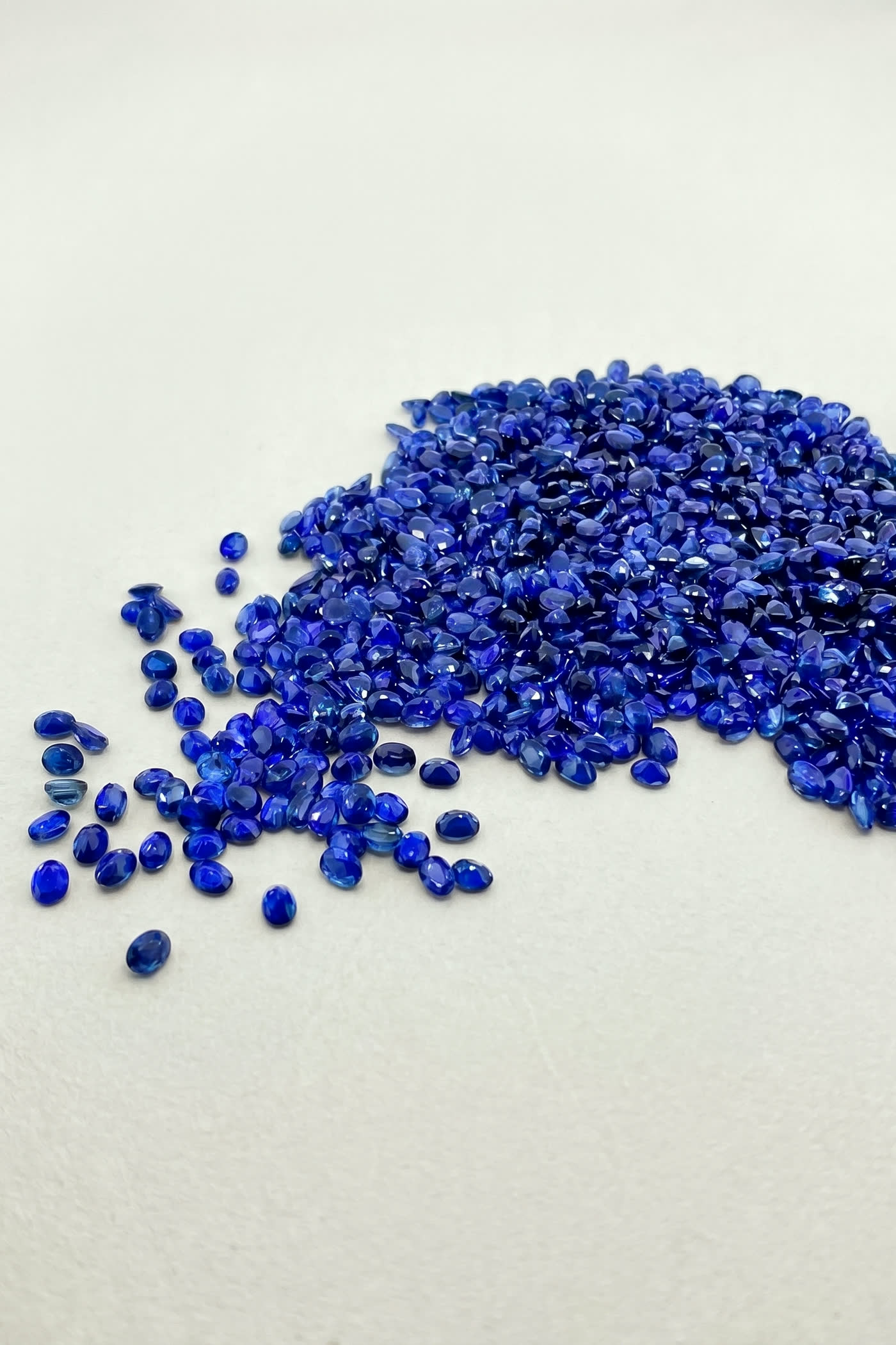 Colored gemstones laid in a rainbow gradient