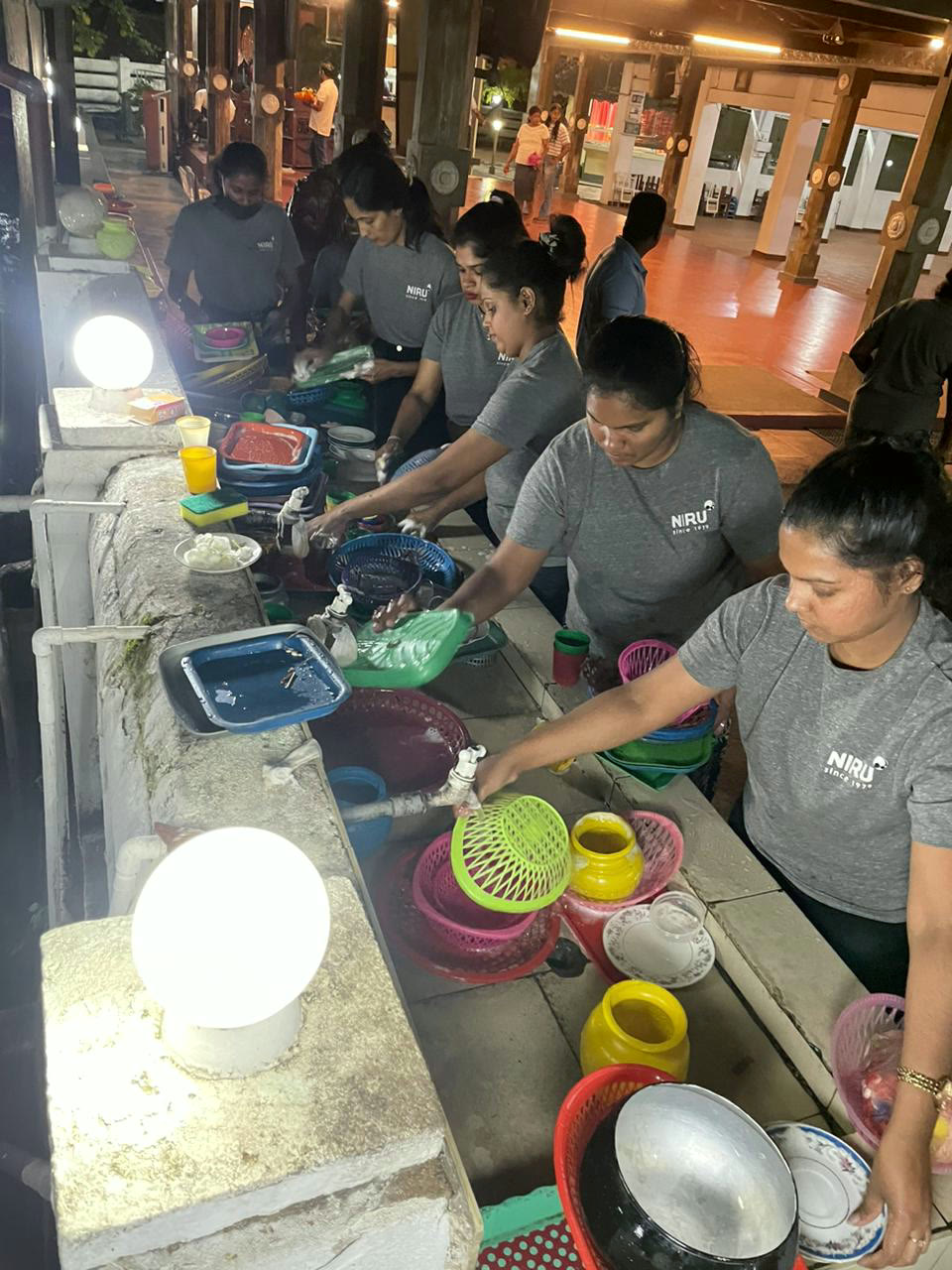NIRU volunteers supporting a community initiative in the evening