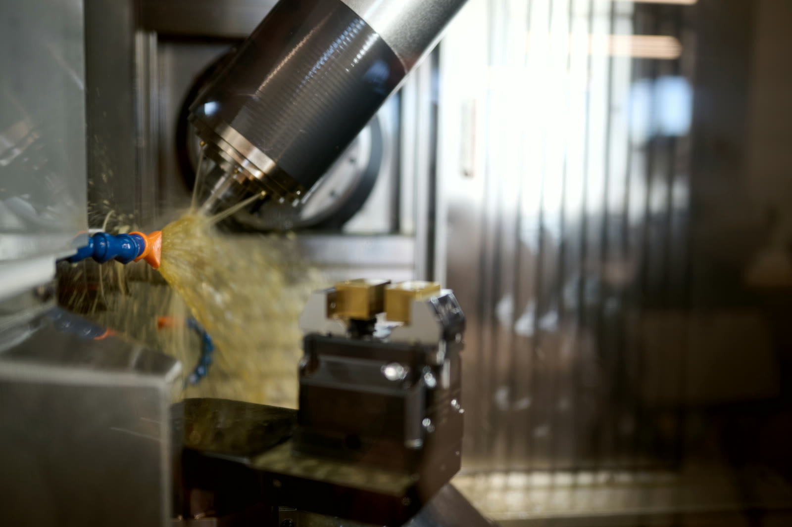 5-axis milling cutter machining a watch component inside the CNC machine