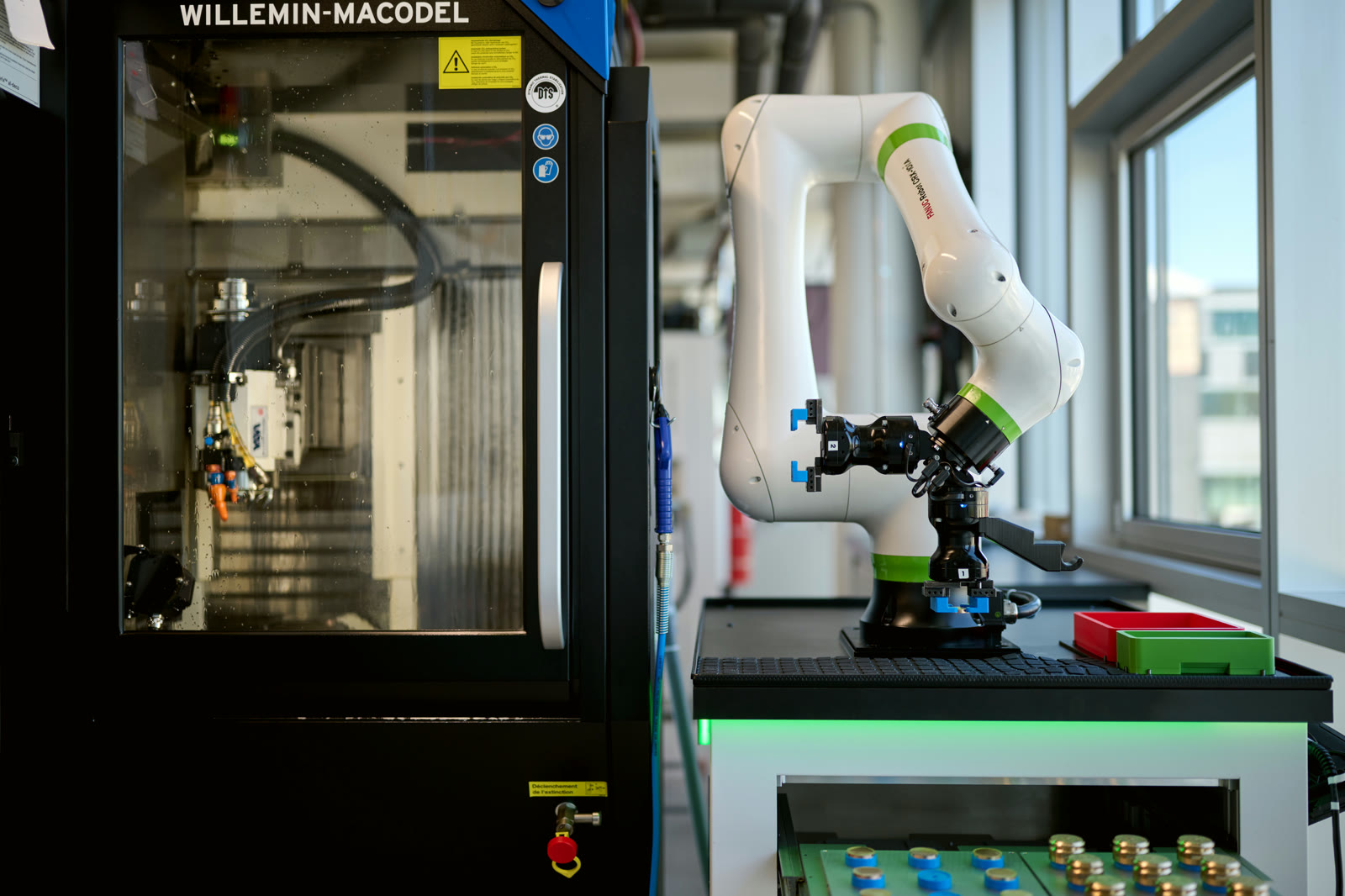 CNC machines with robot loader on the Geneva manufacturing floor