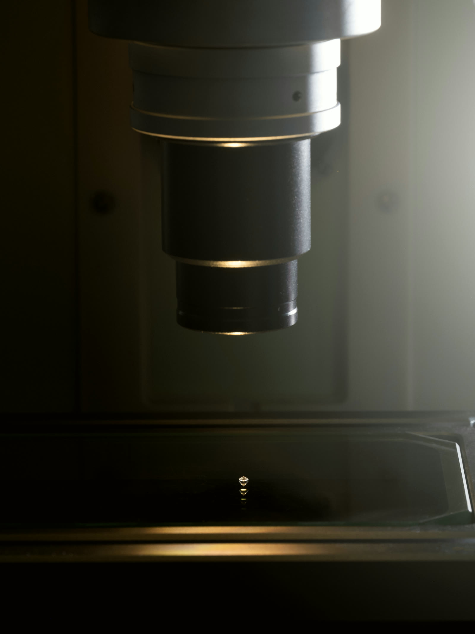 Optical comparator lens over a machined component