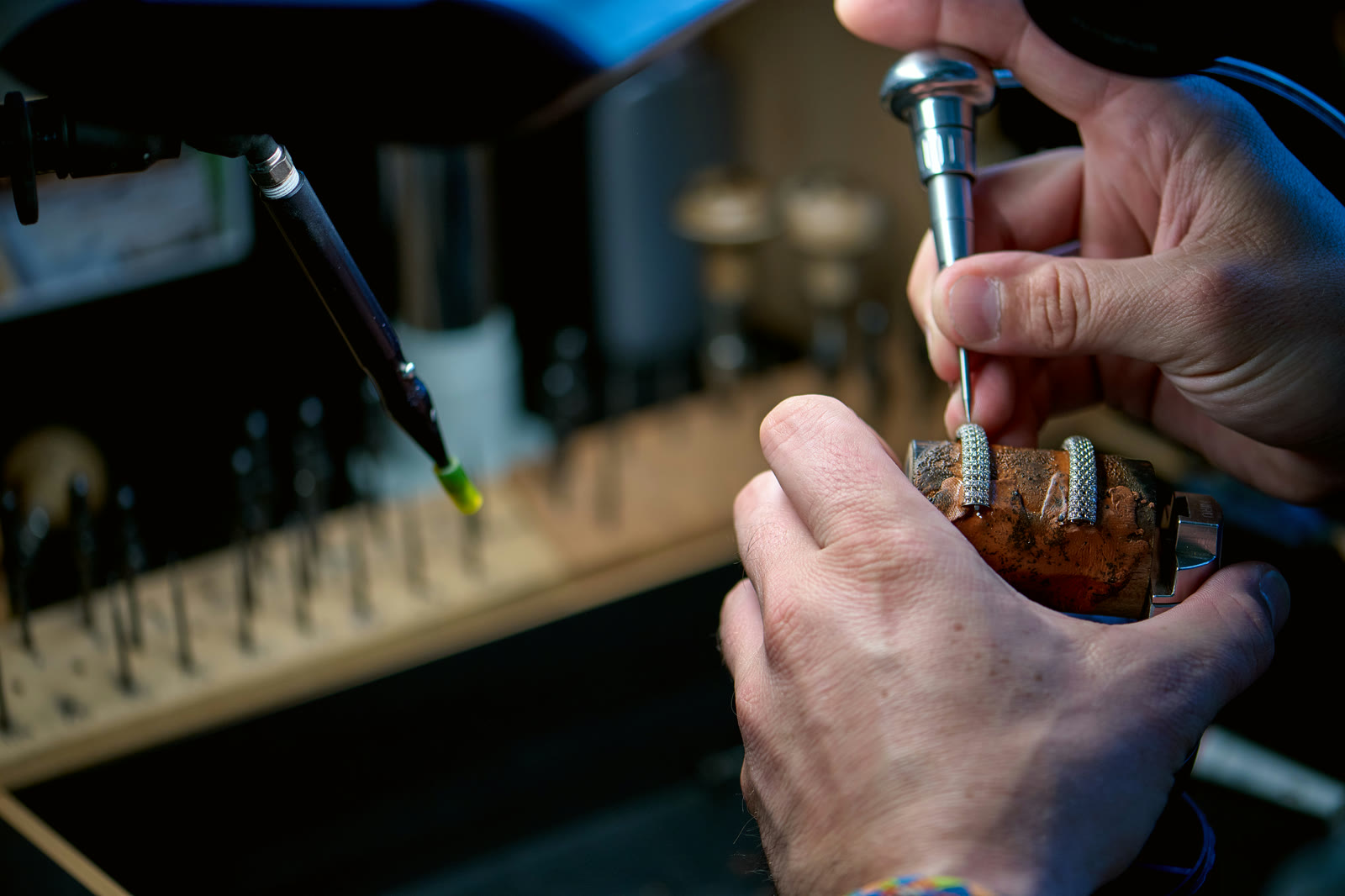 Graver work on a piece held in the ball vise at the setting workshop