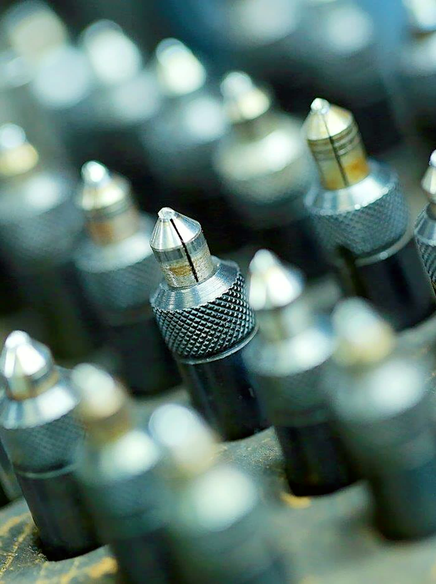 Array of diamond dop sticks at the NIRU manufacture, each tool tracked end to end across every stage